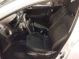 the interior of a white car with black seats and a steering wheel