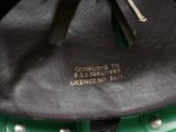 leather handbag with metal studs and a black leather handle