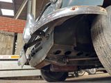 a close up of a truck with a flat tire