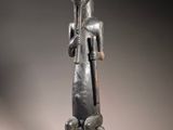a statue of a man with a flute in his hand