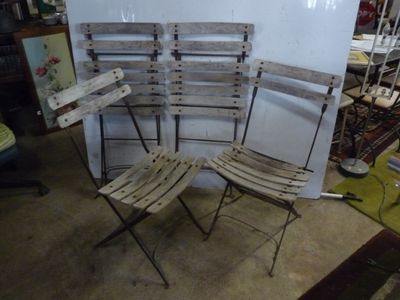 four chairs that are sitting in a room together