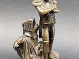bronze figurine of a soldier and a woman