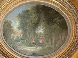 a painting of a man riding a horse in a wooded area