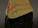a close up of a military hat on a mannequin head