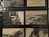several black and white photographs of a rocky coast with a lighthouse in the distance