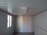 a room with a white ceiling and a window in it