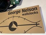 a book with a clock on it sitting on a table