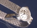 a close up of a wrist watch with a metal band