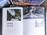 a book open on a table with a bunch of books