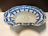 a blue and white bowl sitting on a table