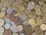 a lot of coins that are on the table