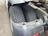 a close up of a tire on the back of a truck