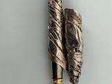 two pens that are sitting on top of a table