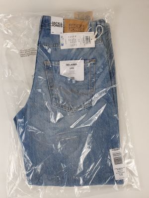 the back of a pair of blue jeans wrapped in plastic