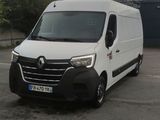 a white van that is parked in a parking lot