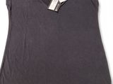 a women ' s t - shirt with a tag on it
