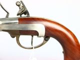 a close up of a gun with a wooden handle