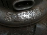 a close up of a metal object with a tag on it