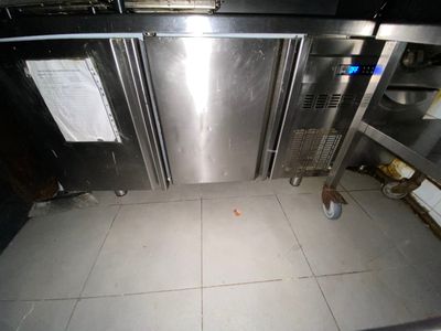 an image of a kitchen with a lot of stainless steel appliances