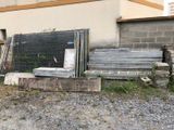 a pile of wood sitting in front of a building
