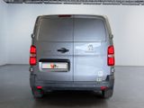 a silver van that is parked in a garage