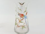 a glass vase with a bird painted on it