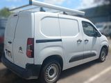 a white van that is parked in a parking lot
