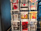 a display of greeting cards on a rack in a room