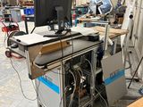 a computer sitting on a table in a factory