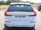 the rear end of a white volvo suv parked in a parking lot