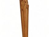 wooden statue of a woman with a crown on her head