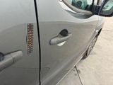 a close up of a car door handle with a sticker on it