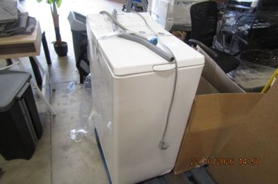 an image of a white refrigerator in a room