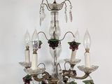 a chandelier with a bunch of candles hanging from it