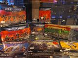 display case of warhammers and warhammers miniatures displayed in glass case