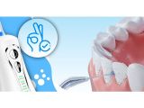 a toothbrush and toothpaste with a tooth brush in front of it