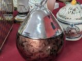 many vases and other decorative items on a table