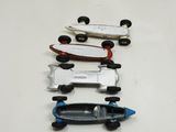 four toy cars that are lined up on a table