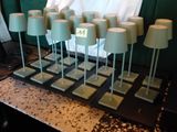 a table with a bunch of cake pops on top of it