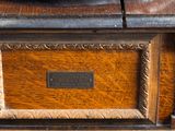a close up of a wooden table with a clock on it