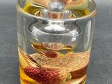 a glass jar with some food in it on a table