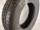 a close up of a tire on a white surface
