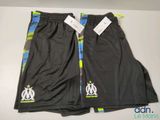 a pair of soccer shorts with a logo on the side