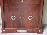a wooden cabinet with a clock on top of it