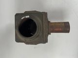 a rusted metal pipe with a hole in the middle