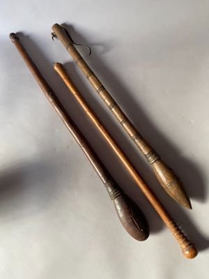 three old wooden crochets are laying on a white surface