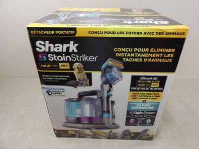 the box of the shark steamer is open on the table
