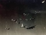 a lot of airplanes flying in the sky together