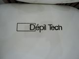 a close up of a toilet seat with the word depilit tech written on it