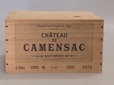 une boîte en bois sur laquelle est apposée une étiquette portant l'inscription « Château Camensac »